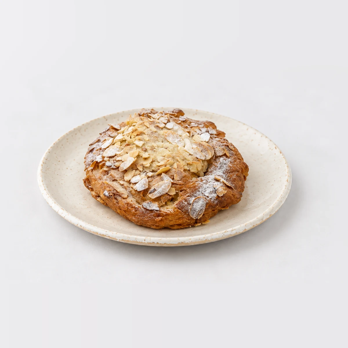 Almond Croissant, whole on a plate