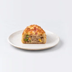 Cheese Bacon Sausage Roll, cut in half