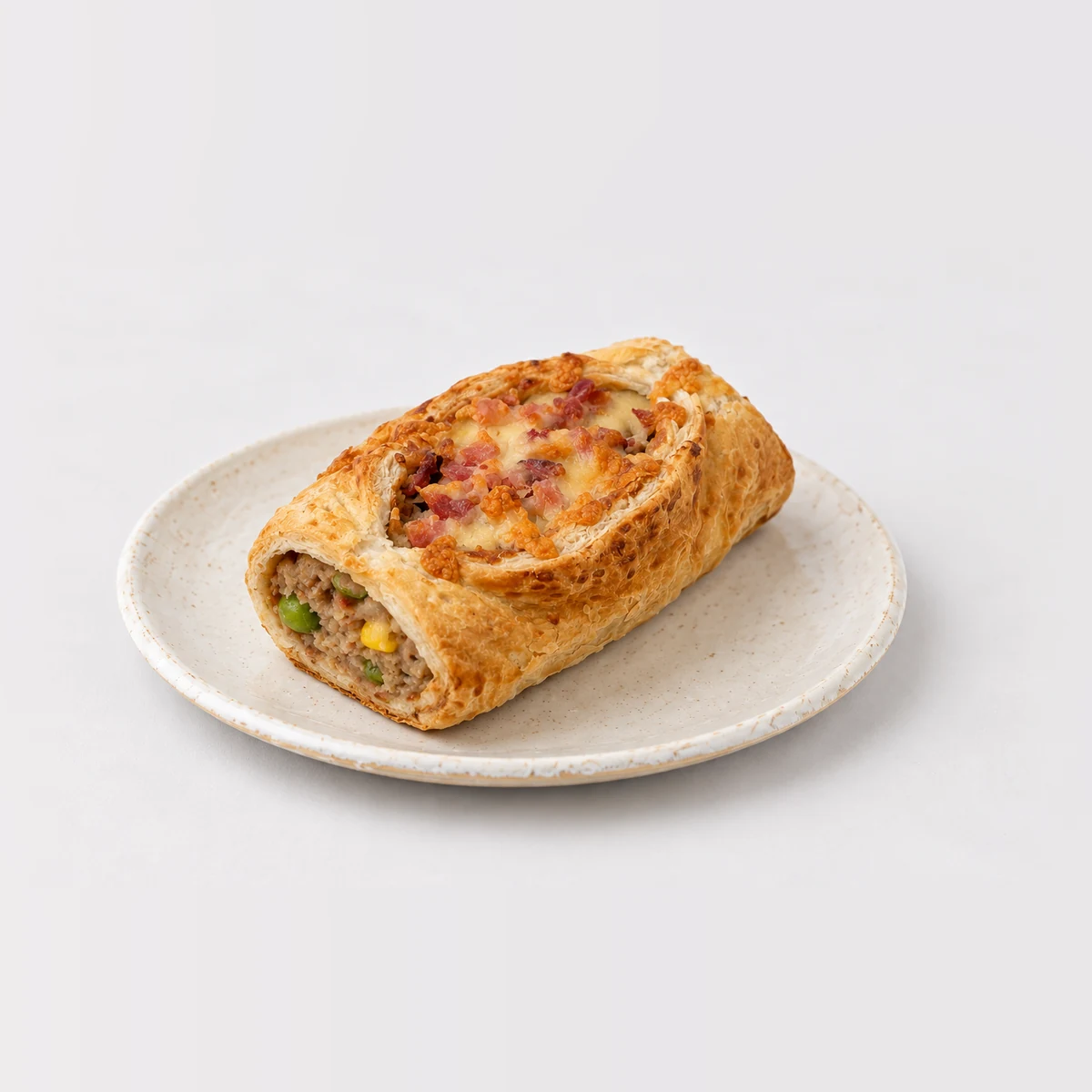 Cheese Bacon Sausage Roll, whole on a plate