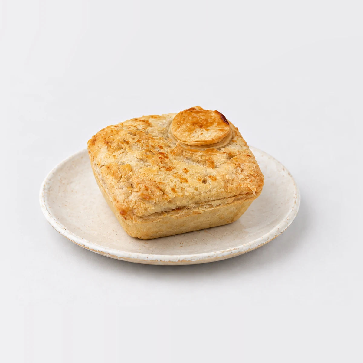 Chicken & Leek Pie, whole on a plate
