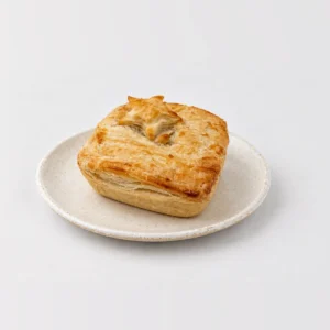 Chicken and Vegetable Pie, whole on a plate