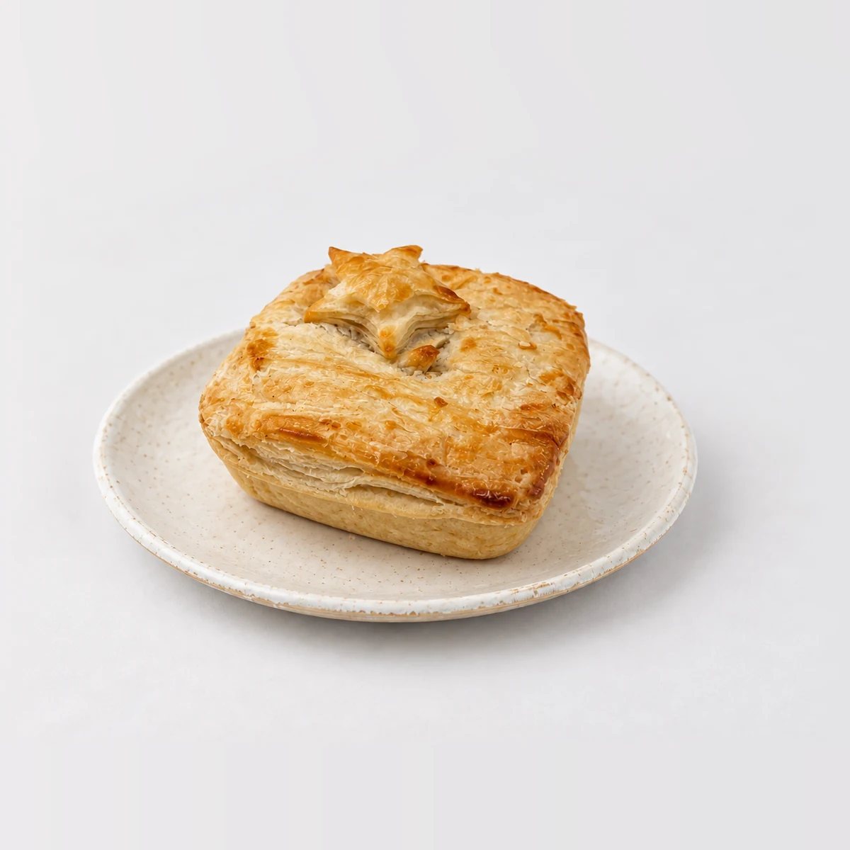 Chicken and Vegetable Pie, whole on a plate