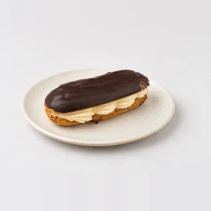 Chocolate Eclair, whole on a plate