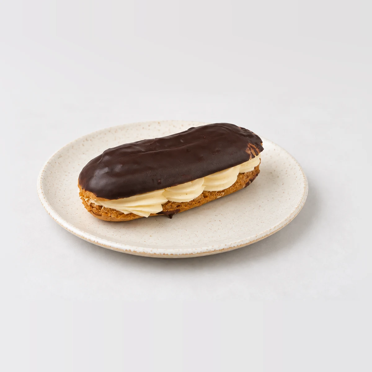 Chocolate Eclair, whole on a plate