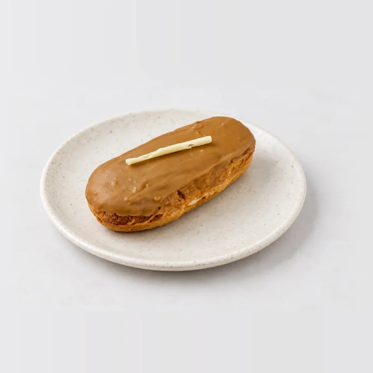 Coffee Eclair, whole on a plate