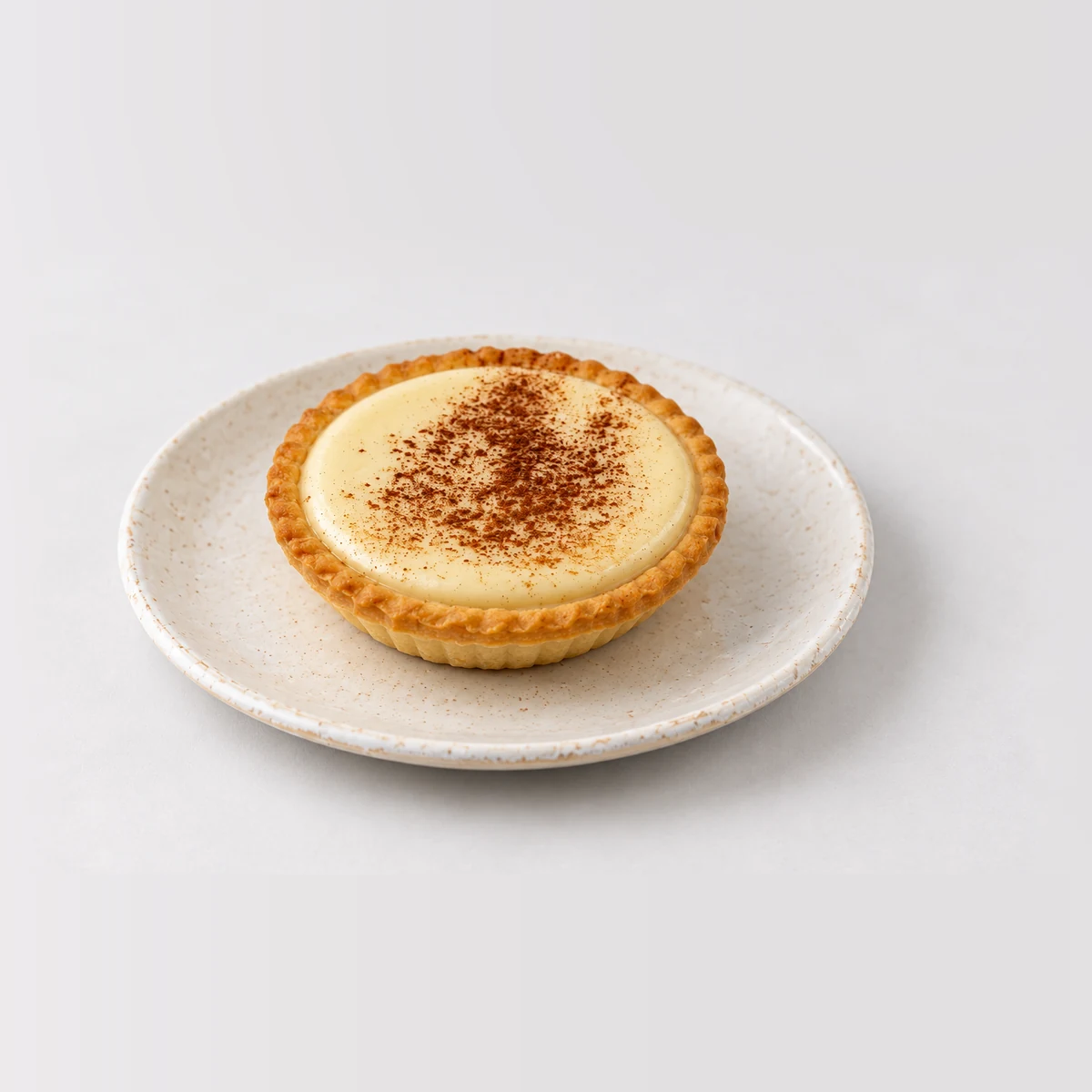Custard Tart, whole on a plate