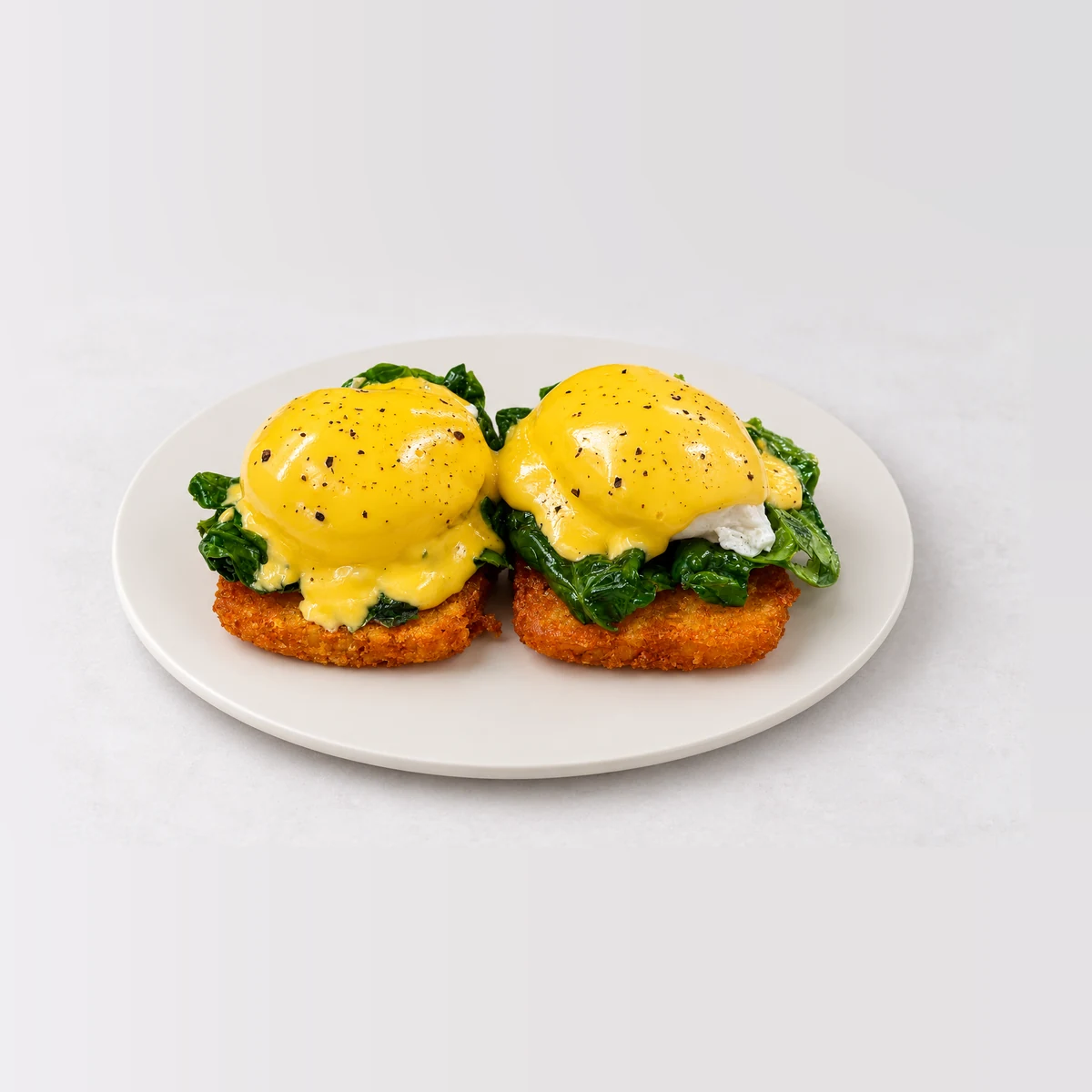 Eggs Florentine, whole on a plate