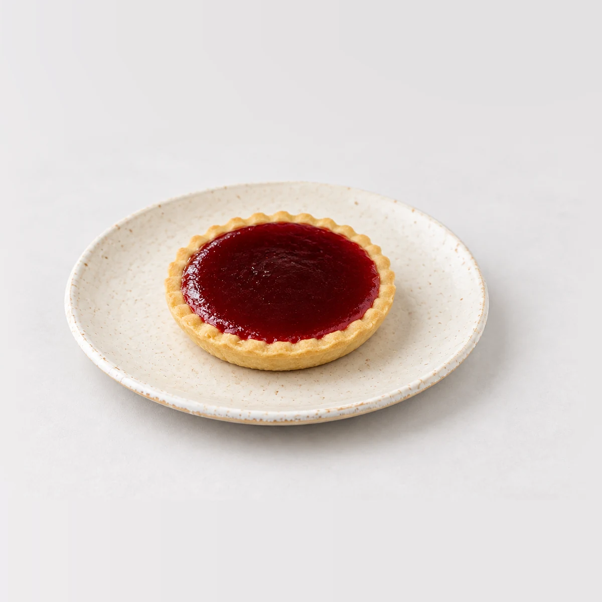Jam Tart, whole on a plate