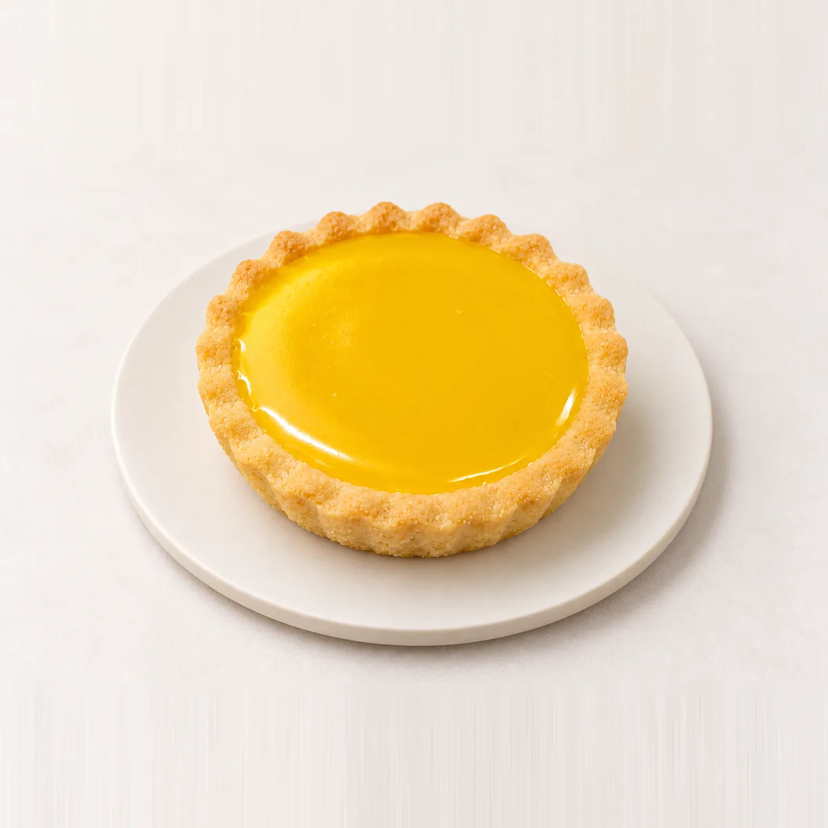 Individual yellow jam tart