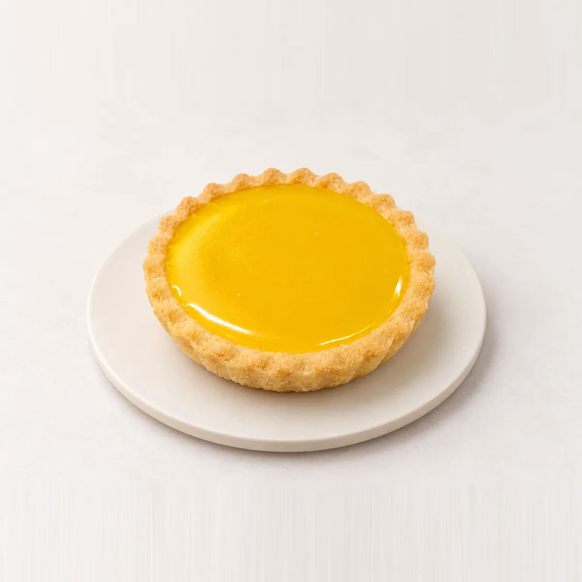 Individual yellow jam tart