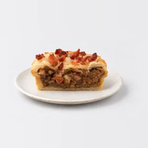 Steak and Bacon Pie, cut in half