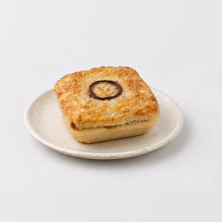 Steak and Onion Pie, whole on a plate