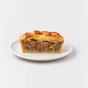 Steak Cheese and Bacon Pie, cut in half