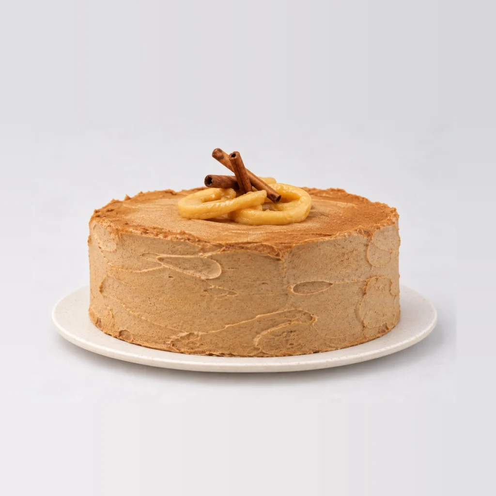 Side view of the apple and cinnamon tea cake showing the swirled cinnamon frosting.