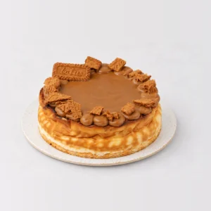 Baked Biscoff cheesecake topped with Biscoff caramel, piped rosettes and Lotus biscuits.