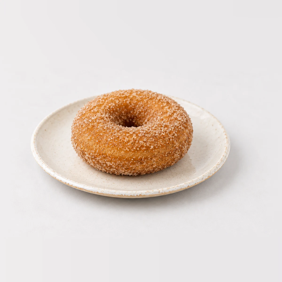 Cinnamon Donut, whole on a plate