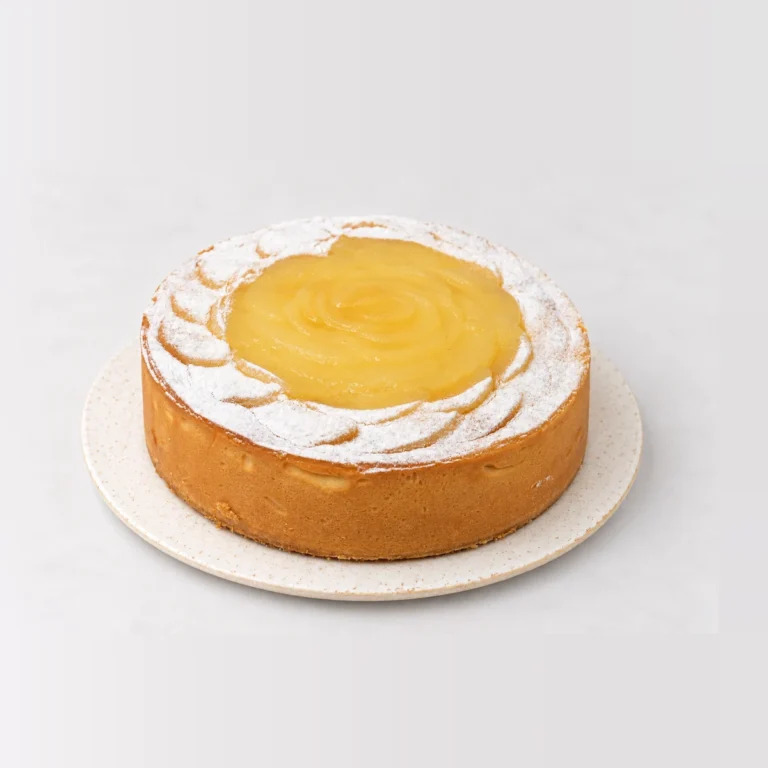 Lemon Lime & Pear Tart, whole on a plate