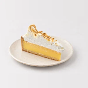Slice of lemon meringue tart: lemon curd in a shortcrust base under caramelised meringue.