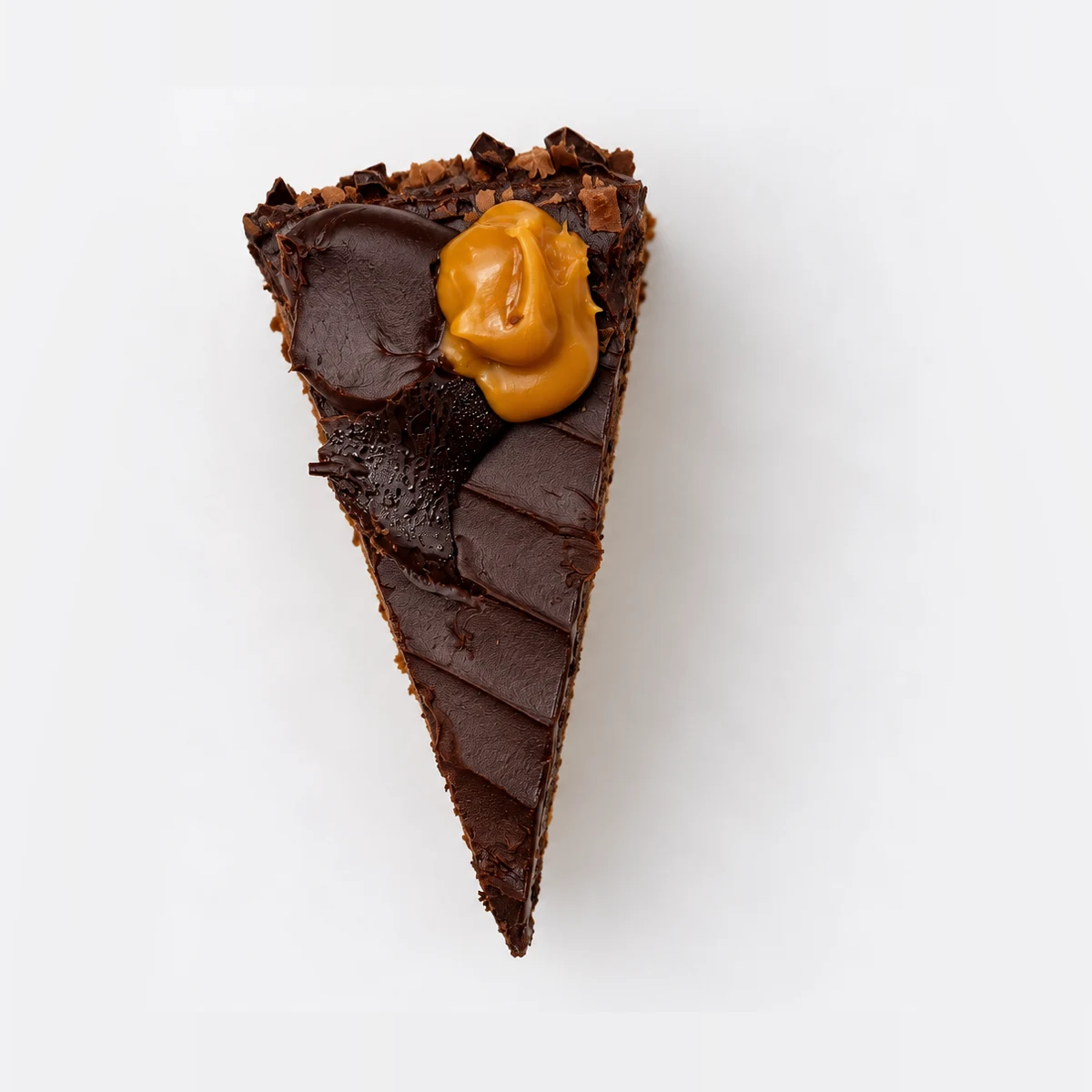 Marz Bar cake slice from above: chocolate ganache with a chocolate shard and a caramel dollop.