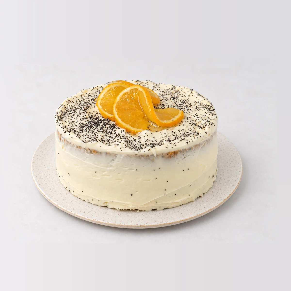 Orange & Poppyseed Tea Cake, whole on a plate