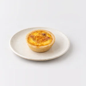 Party Egg, Bacon & Cheese Quiche (Large - 40pc), whole on a plate