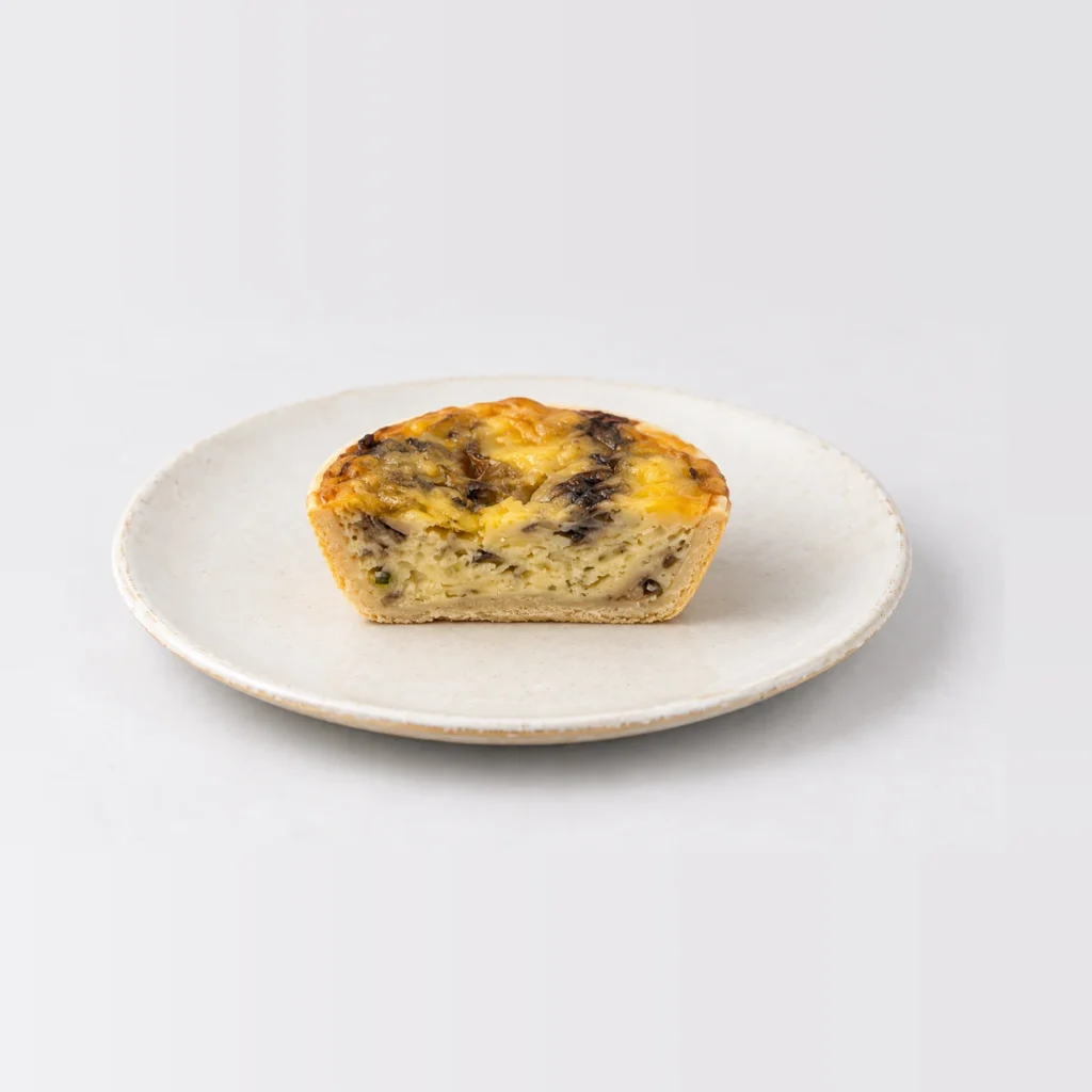 Party Egg, Mushroom & Cheese Quiche (Large - 40pc), cut in half
