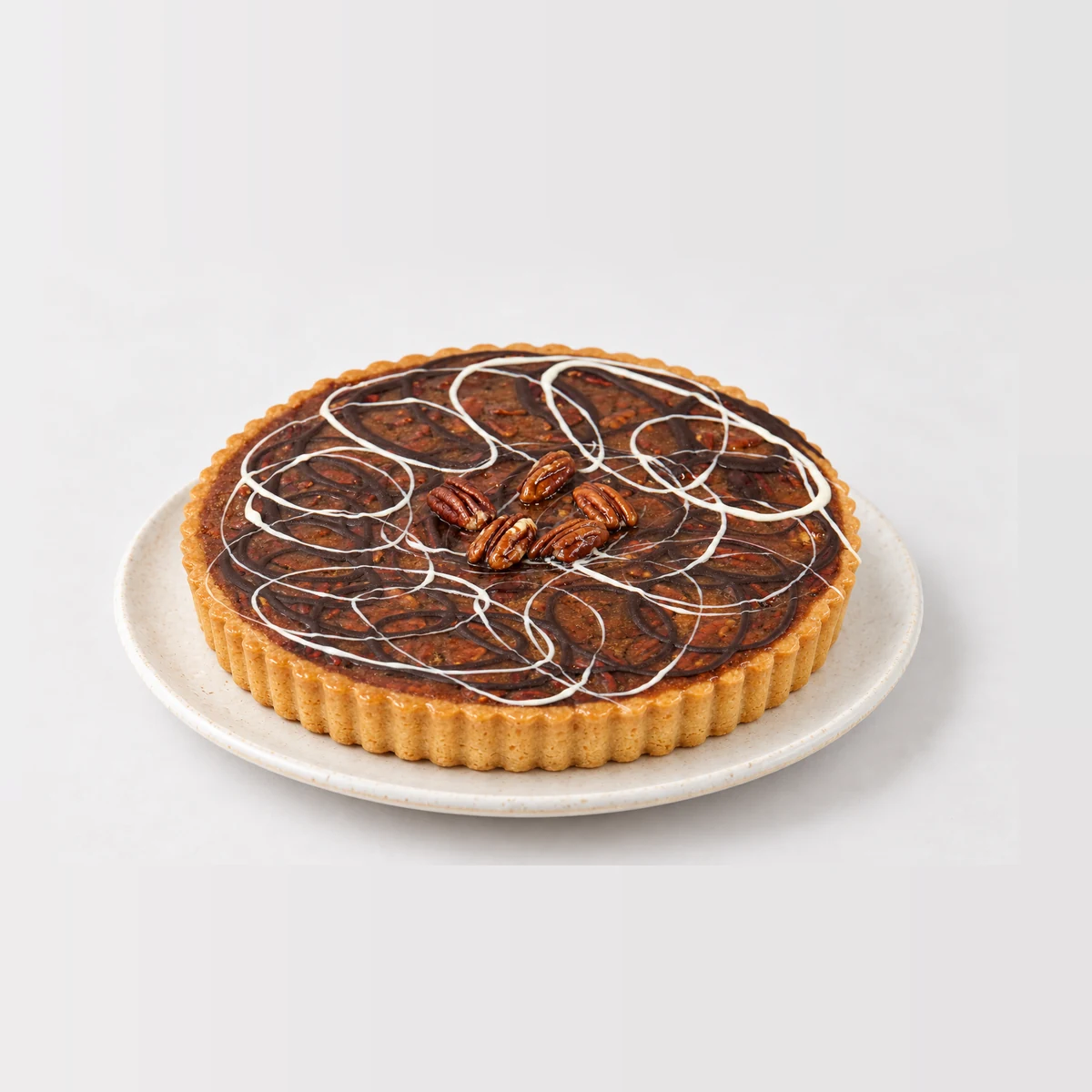 Pecan Tart, whole on a plate