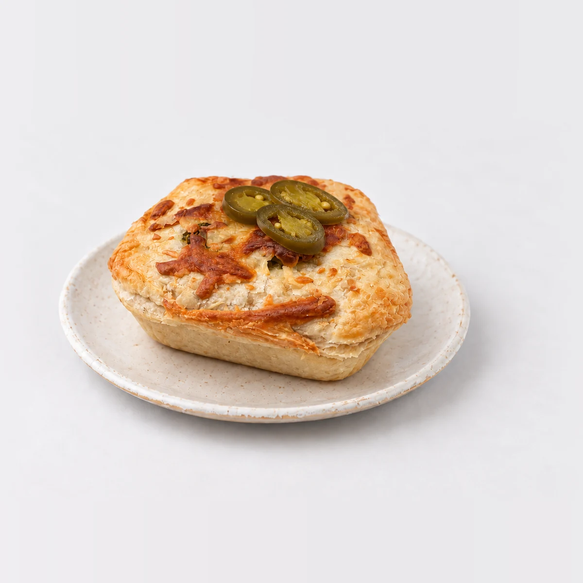 Chunky Beef, Jalapeño & Cheddar Cheese Pie, whole on a plate