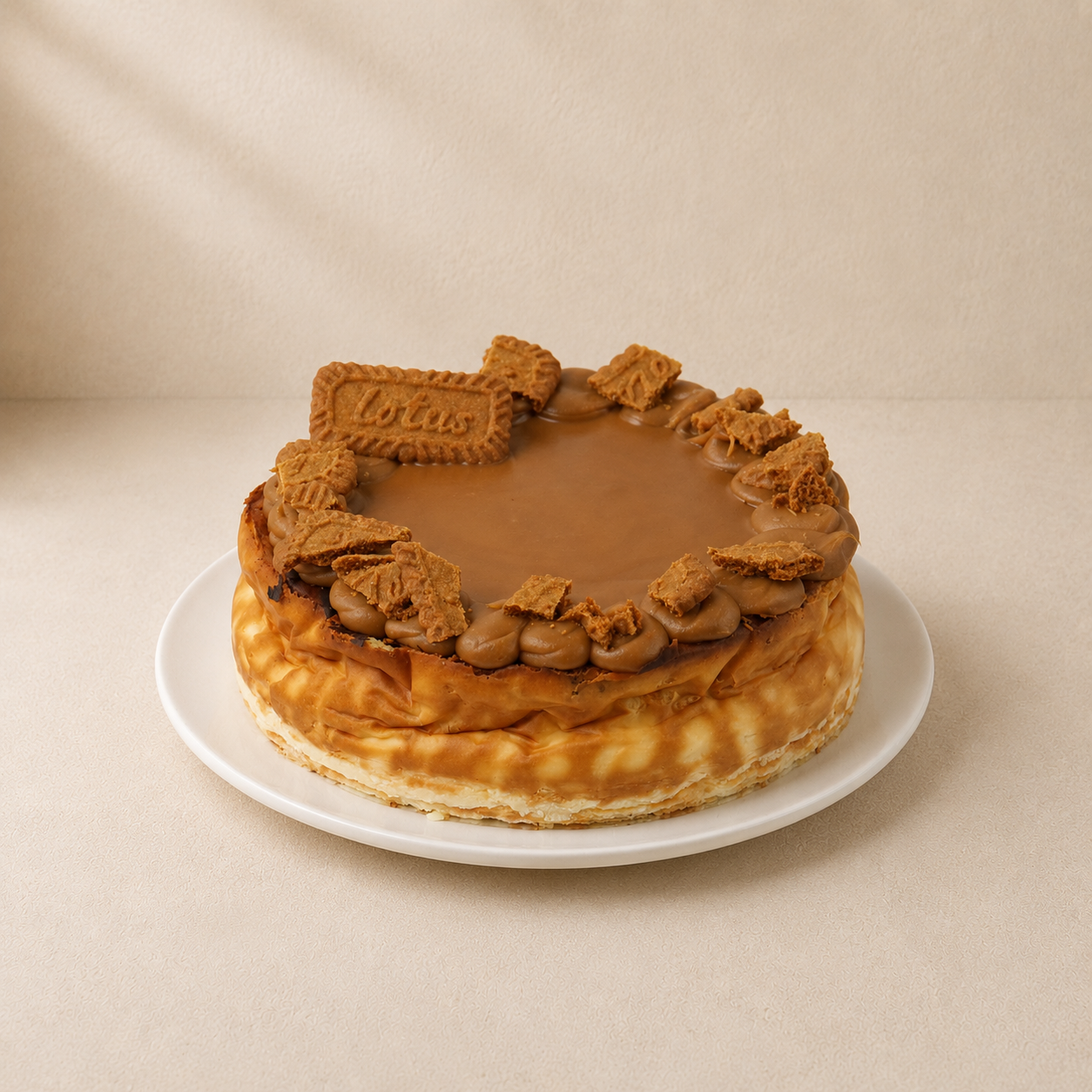 Flavoured baked cheesecake finished with caramel, cream rosettes and Biscoff biscuits.
