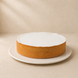 Lemon tart with a smooth, pale lemon filling and golden pastry.