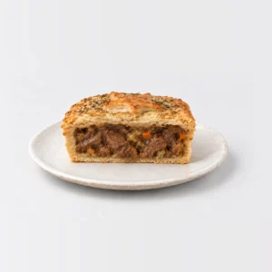 Chunky Rosemary, Lamb & Vegetable Pie, cut in half