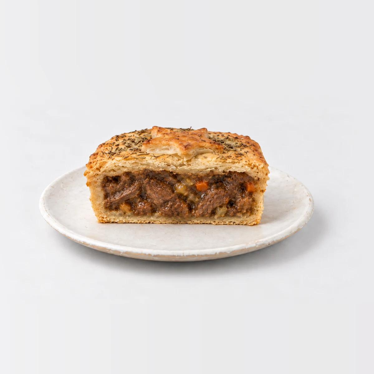 Chunky Rosemary, Lamb & Vegetable Pie, cut in half