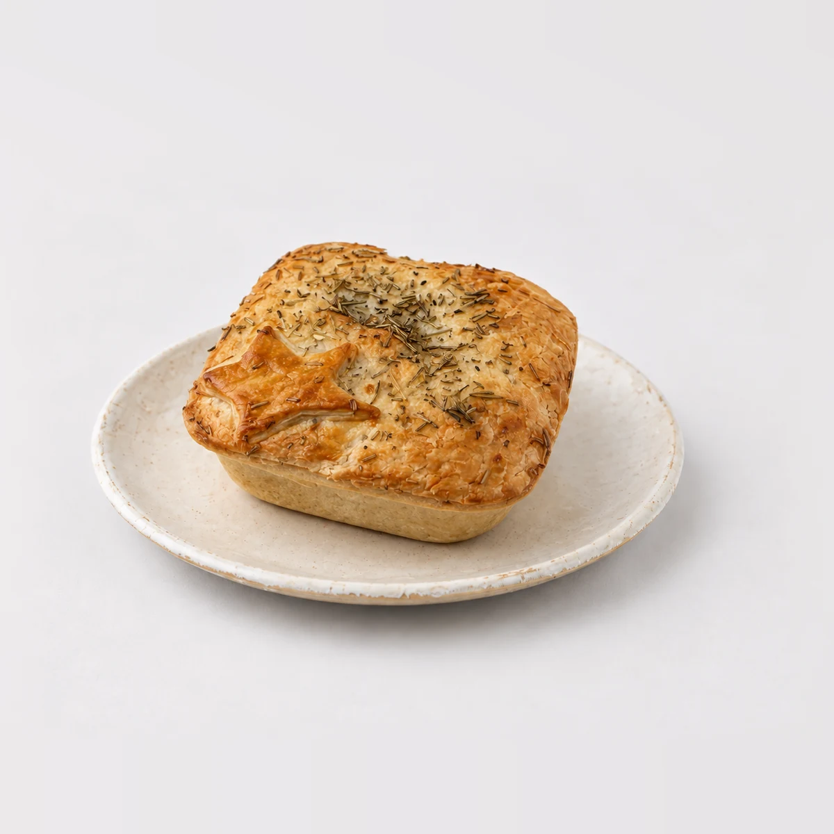 Chunky Rosemary, Lamb & Vegetable Pie, whole on a plate