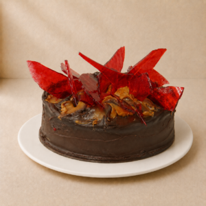 Toffee Mars Cake with dark chocolate ganache, caramel and dramatic red toffee shards on top.