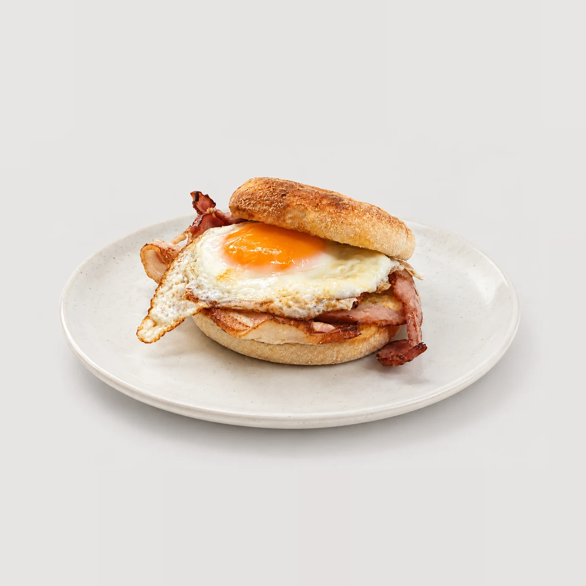 Egg and bacon breakfast roll / muffin — Whole / angled