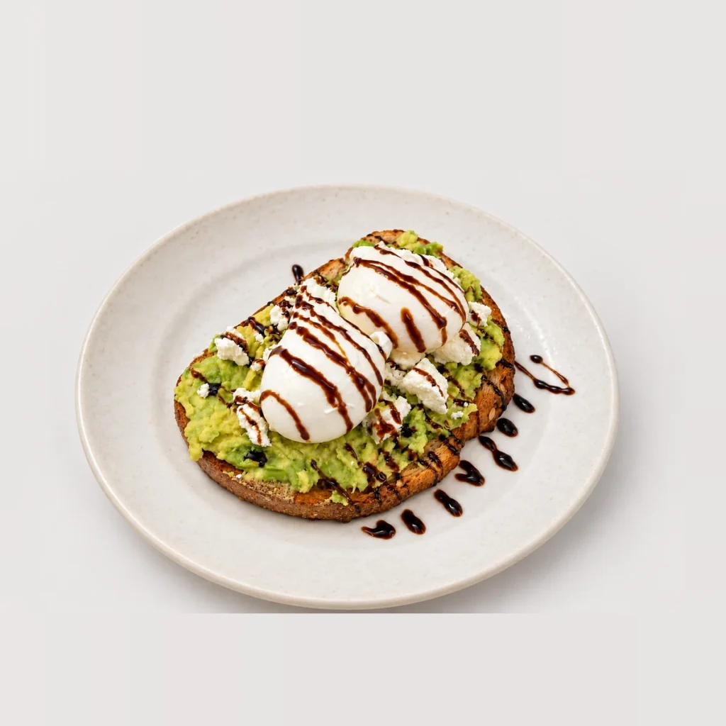Avocado feta toast, poached eggs, dark drizzle — Detail
