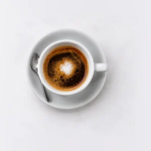 Long Macchiato in the smaller Grinders cup on white background